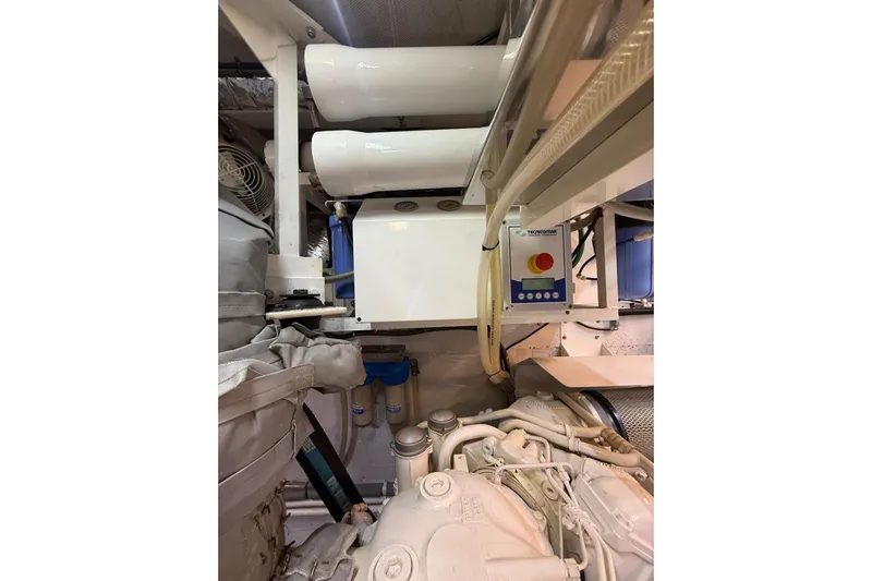  Yacht Photos Pics Engine room of 2014 Princess Flybridge 82 Motor Yacht with visible machinery and controls.