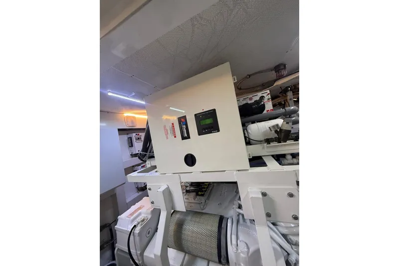  Yacht Photos Pics Engine room of 2014 Princess Flybridge 82 Motor Yacht, featuring control panel and machinery.