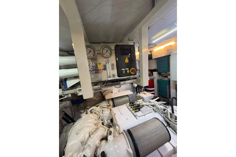  Yacht Photos Pics Engine room of 2014 Princess Flybridge 82 Motor Yacht with control panel and gauges.