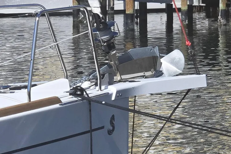 Bluebird Yacht Photos Pics 2023 Beneteau Oceanis 38.1 yacht bow with anchor, docked in calm waters.