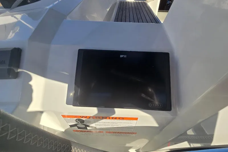Bluebird Yacht Photos Pics Control panel on 2023 Beneteau Oceanis 38.1 yacht, featuring a digital display and warning label.