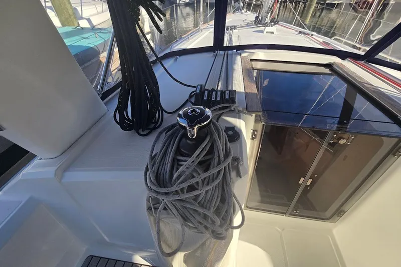 Bluebird Yacht Photos Pics 2023 Beneteau Oceanis 38.1 sailboat cockpit with ropes and winch.