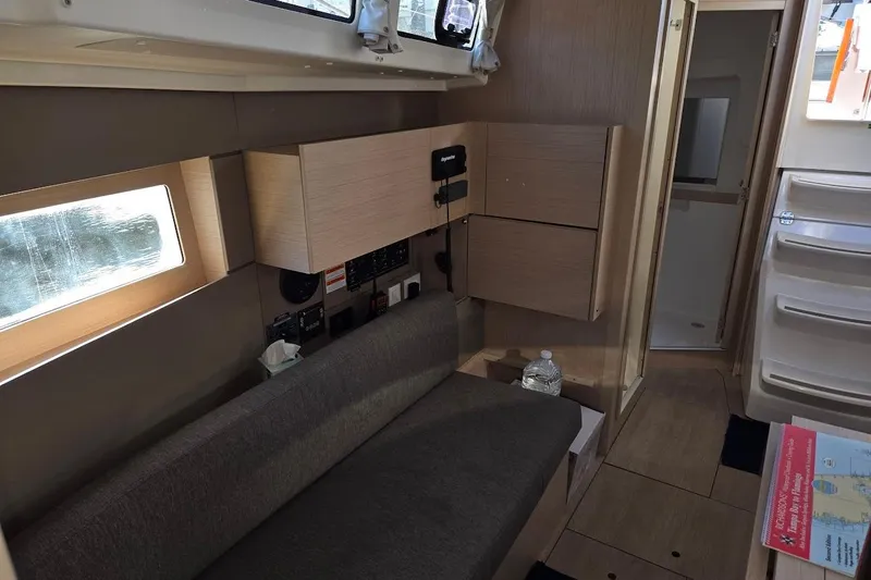 Bluebird Yacht Photos Pics Interior of 2023 Beneteau Oceanis 38.1 yacht, featuring modern seating and cabinetry.