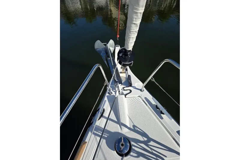 Bluebird Yacht Photos Pics Bow of 2023 Beneteau Oceanis 38.1 sailboat with anchor and railing.