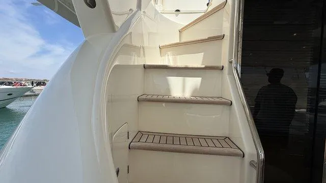 Happy Landing Yacht Photos Pics Staircase on 2007 Ferretti Yachts 731, leading to upper deck with ocean view.