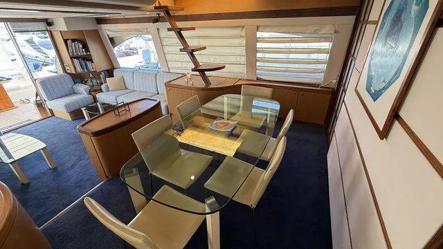 Happy Landing Yacht Photos Pics Luxurious interior of 2007 Ferretti Yachts 731 with elegant dining and seating area.