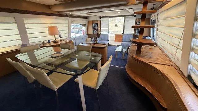 Happy Landing Yacht Photos Pics Luxurious interior of 2007 Ferretti Yachts 731 with elegant dining and seating area.