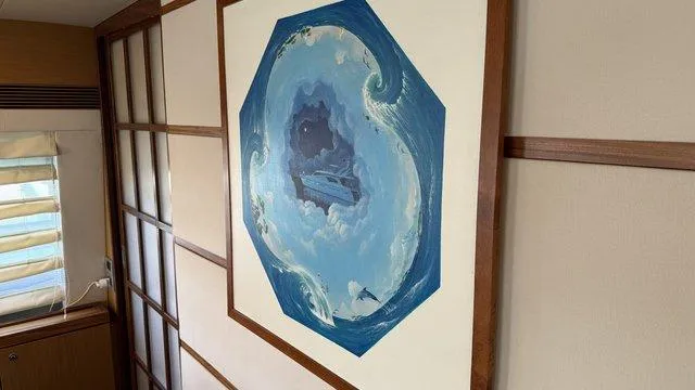 Happy Landing Yacht Photos Pics Wall art on a 2007 Ferretti Yachts 731, featuring a nautical-themed painting.