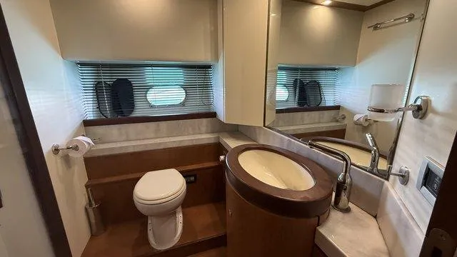 Happy Landing Yacht Photos Pics Luxurious bathroom in 2007 Ferretti Yachts 731, featuring modern fixtures and elegant design.