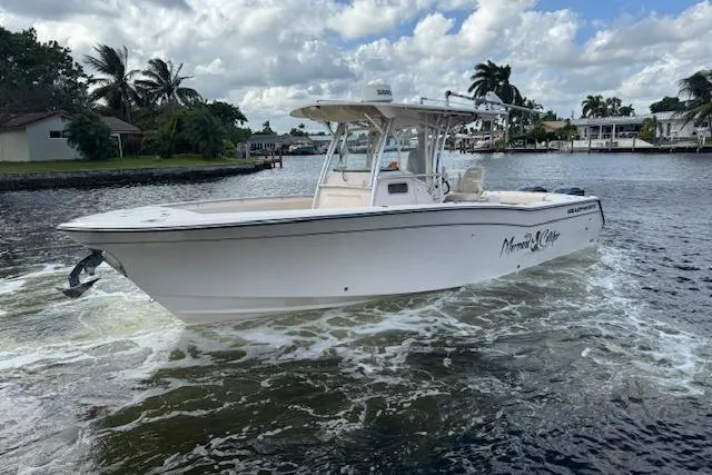  Yacht Photos Pics 2007 Grady-White Bimini 306 boat cruising on a scenic waterway.