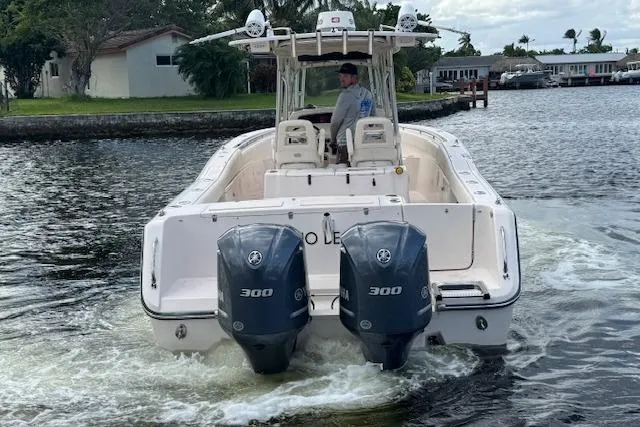  Yacht Photos Pics 2007 Grady-White Bimini 306 boat with dual 300 engines cruising on a waterway.