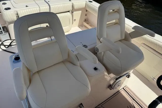  Yacht Photos Pics 2007 Grady-White Bimini 306 boat seats, cream leather, armrests, and deck view.