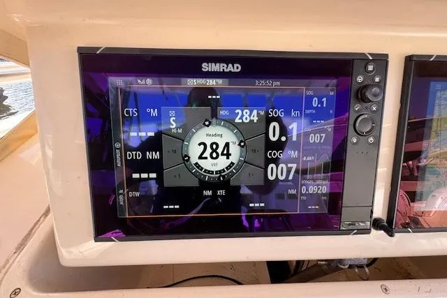  Yacht Photos Pics Simrad navigation display on 2007 Grady-White Bimini 306 boat, showing heading and speed data.