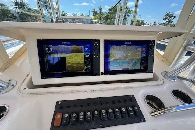  Yacht Photos Pics 2007 Grady-White Bimini 306 boat dashboard with dual Simrad displays and control panel.