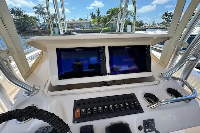  Yacht Photos Pics 2007 Grady-White Bimini 306 boat dashboard with dual Simrad displays and control panel.