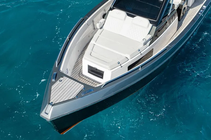  Yacht Photos Pics 2024 Schaefer V33 yacht on clear blue water, showcasing sleek design and luxury features.
