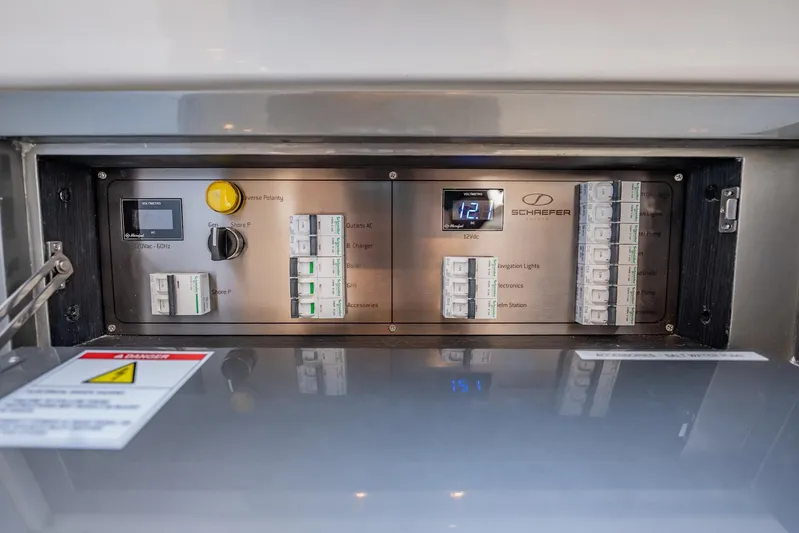  Yacht Photos Pics Electrical control panel of 2024 Schaefer V33 boat, featuring switches and voltage display.