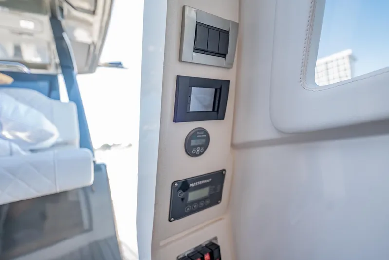  Yacht Photos Pics 2024 Schaefer V33 yacht interior control panel with modern switches and displays.