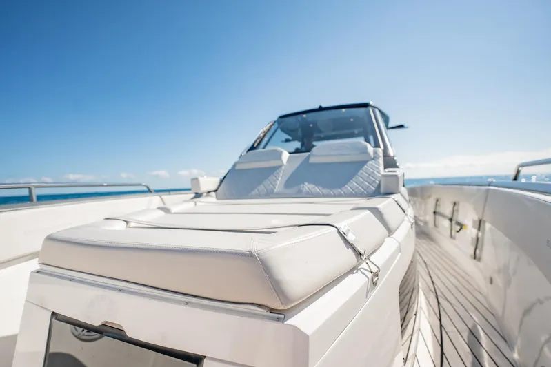 Yacht Photos Pics 2024 Schaefer V33 yacht with luxurious deck and seating, under clear blue sky.