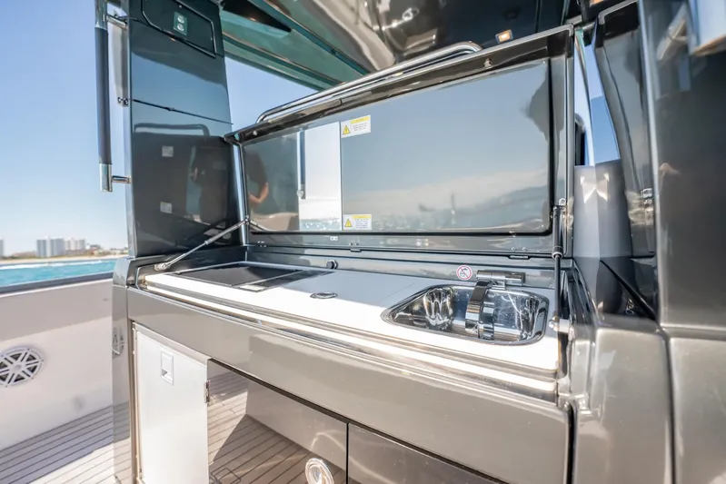  Yacht Photos Pics 2024 Schaefer V33 yacht kitchen area with sleek design and modern amenities.