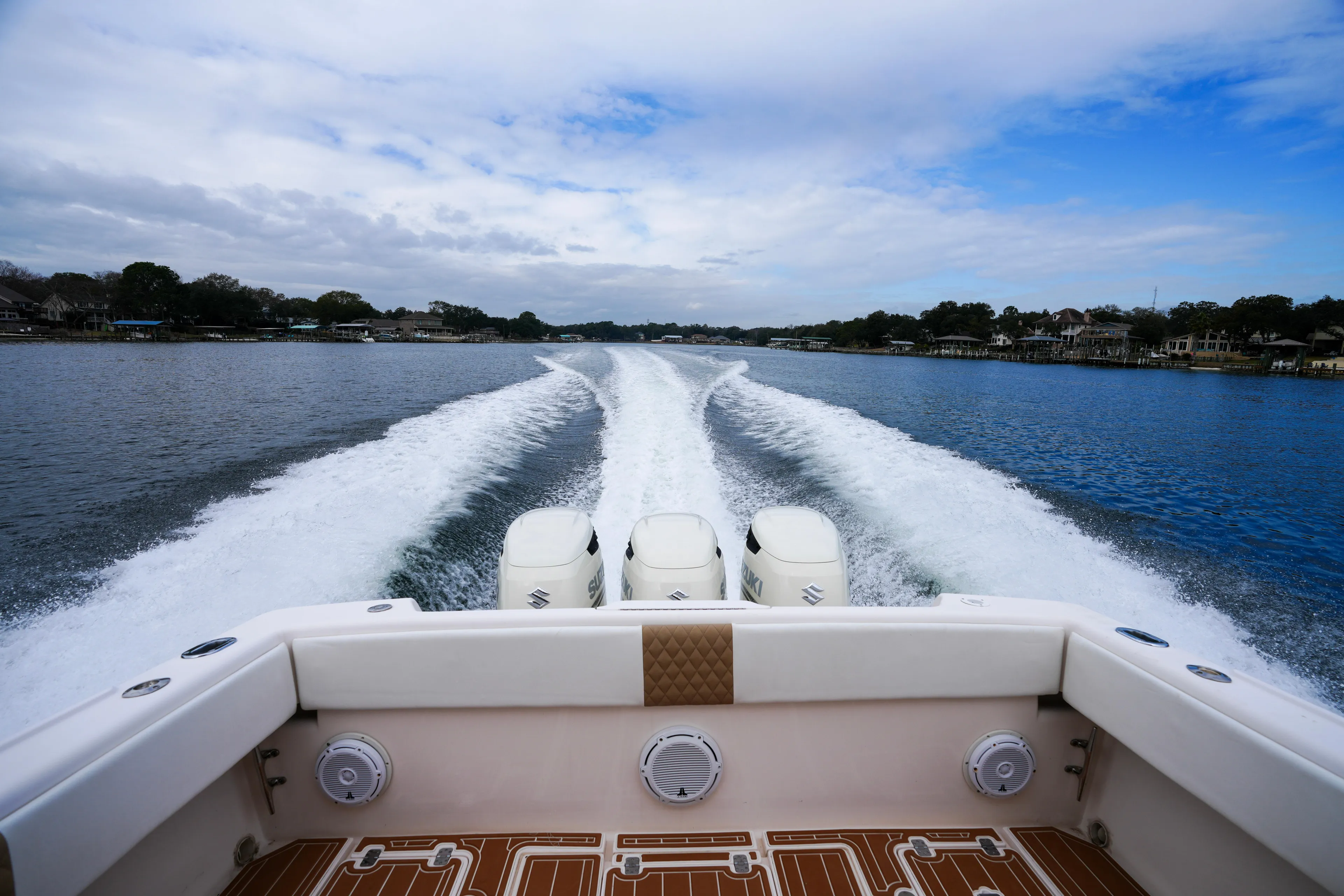  Yacht Photos Pics 1999 Intrepid 366 boat cruising on a lake, leaving a wake behind.