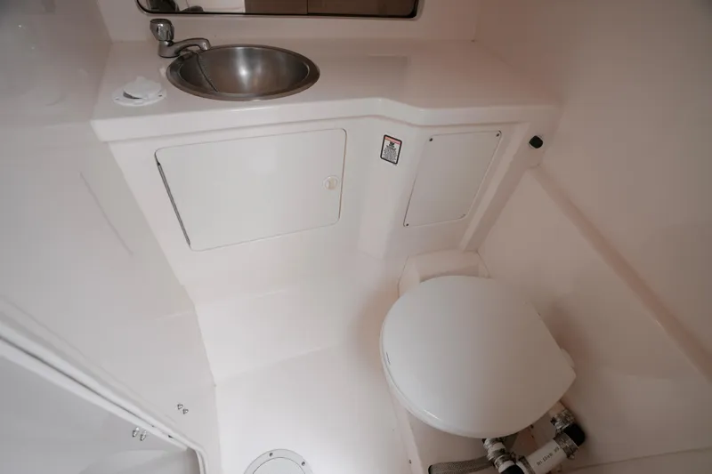  Yacht Photos Pics 1999 Intrepid 366 boat bathroom with sink and toilet.