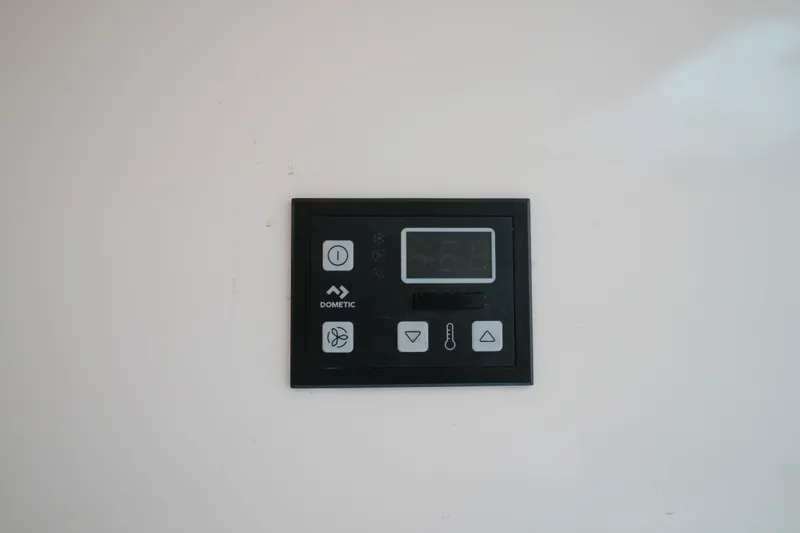  Yacht Photos Pics Control panel on a 1999 Intrepid 366 boat, featuring Dometic system.