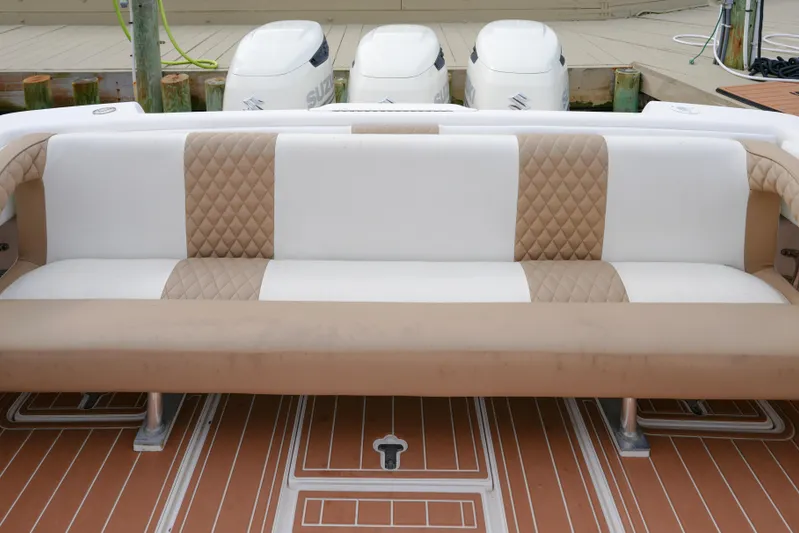  Yacht Photos Pics Luxury seating on 1999 Intrepid 366 boat with quilted upholstery and triple outboard engines.