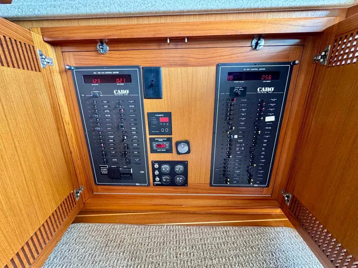 Bill Slayer Yacht Photos Pics Electrical panel of 2002 Cabo 47 Flybridge Sportfisher with wooden cabinet.