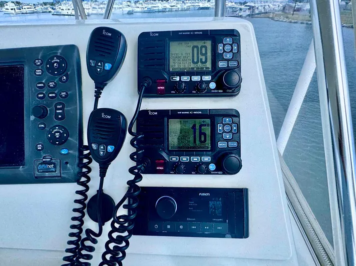 Bill Slayer Yacht Photos Pics Control panel of 2002 Cabo 47 Flybridge Sportfisher with communication devices.