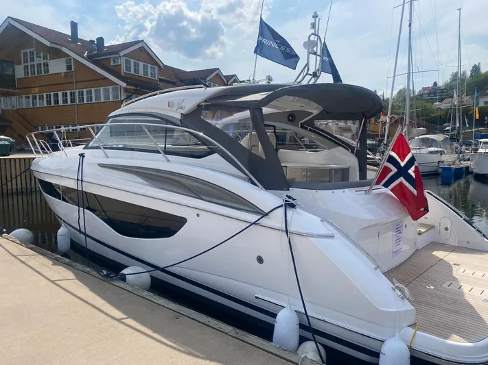 V40157 Yacht Photos Pics 2023 Princess V40 yacht docked, featuring sleek design and Norwegian flag.