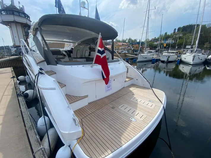 V40157 Yacht Photos Pics 2023 Princess V40 yacht docked, featuring a sleek design and Norwegian flag.