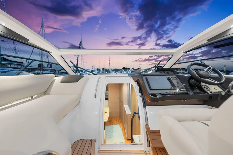 V40157 Yacht Photos Pics Luxurious 2023 Princess V40 yacht interior with sunset view and modern cockpit design.