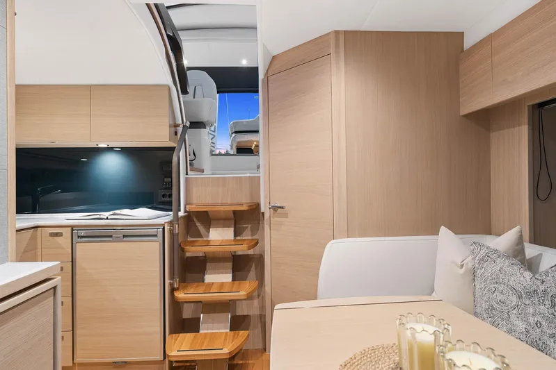 V40157 Yacht Photos Pics Interior of 2023 Princess V40 yacht, featuring modern kitchen and cozy seating area.