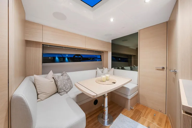 V40157 Yacht Photos Pics Modern interior of 2023 Princess V40 yacht with elegant seating and table.