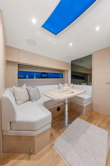 V40157 Yacht Photos Pics Luxurious interior of 2023 Princess V40 yacht with modern seating and skylight.