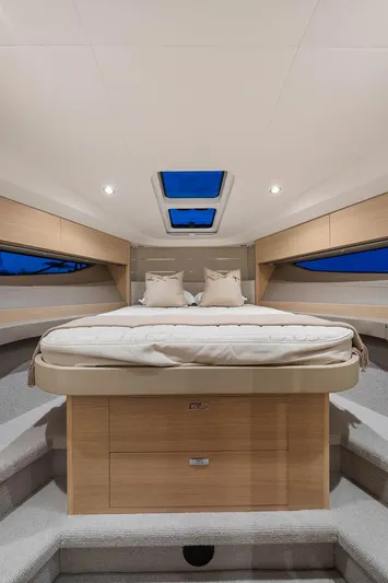 V40157 Yacht Photos Pics Luxurious interior of 2023 Princess V40 yacht with elegant bedding and skylight.