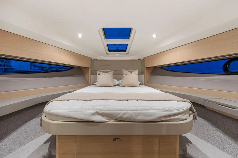 V40157 Yacht Photos Pics Luxurious interior of 2023 Princess V40 yacht with spacious bed and skylight.