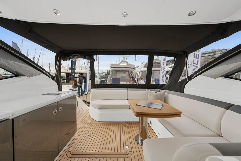 V40157 Yacht Photos Pics Luxurious 2023 Princess V40 yacht interior with elegant seating and wooden flooring.