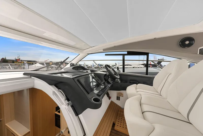V40157 Yacht Photos Pics 2023 Princess V40 yacht interior with modern helm and luxurious seating.