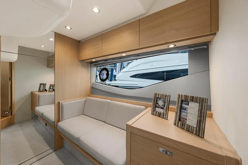 V40157 Yacht Photos Pics Luxurious interior of 2023 Princess V40 yacht with modern furnishings and large window view.
