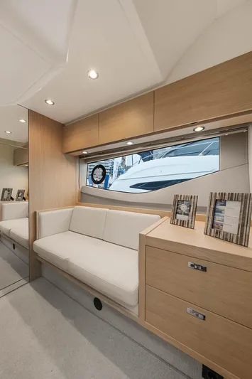 V40157 Yacht Photos Pics Luxurious interior of 2023 Princess V40 yacht with modern furnishings and large window view.