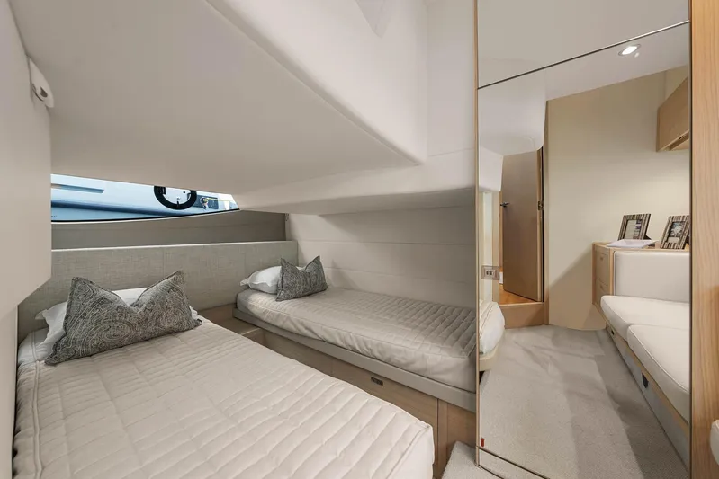 V40157 Yacht Photos Pics Luxurious 2023 Princess V40 yacht cabin with twin beds and modern decor.