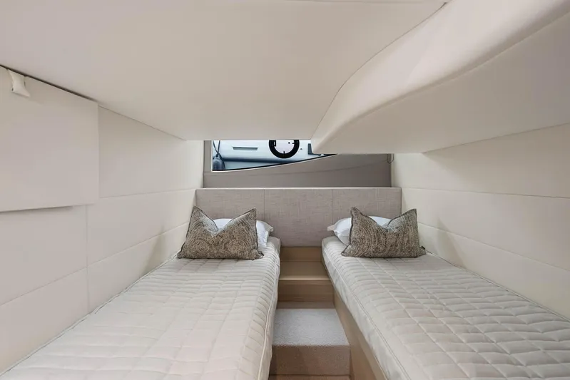 V40157 Yacht Photos Pics Luxurious interior of 2023 Princess V40 yacht with twin beds and elegant decor.