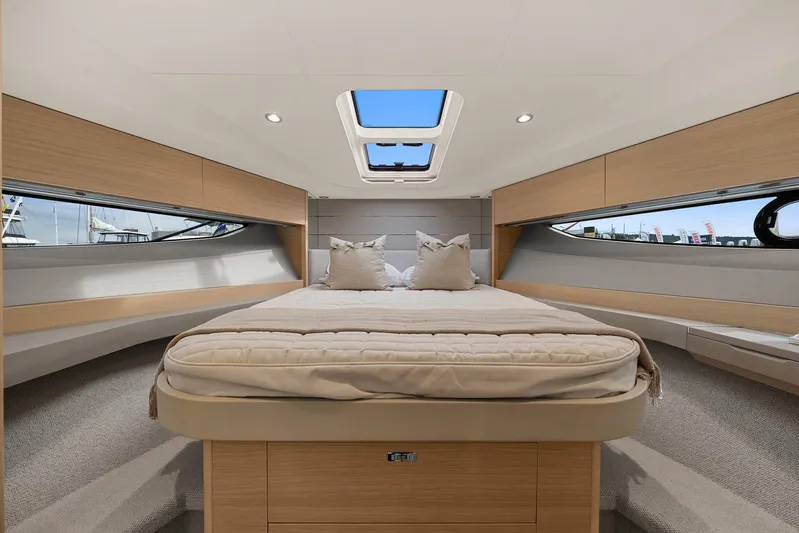 V40157 Yacht Photos Pics Luxurious 2023 Princess V40 yacht interior with skylight and elegant bedding.