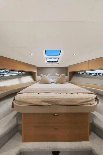 V40157 Yacht Photos Pics Luxurious interior of 2023 Princess V40 yacht with skylight and elegant bedding.