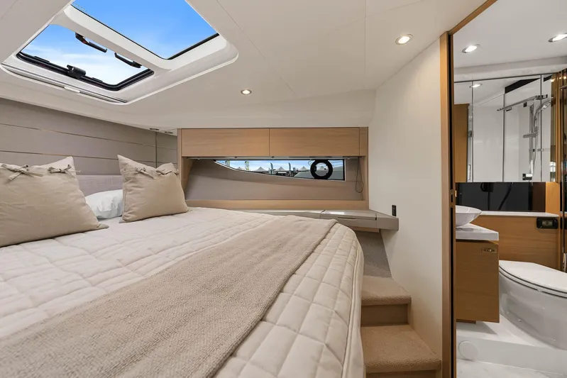 V40157 Yacht Photos Pics Luxurious interior of 2023 Princess V40 yacht with cozy bedroom and modern bathroom.