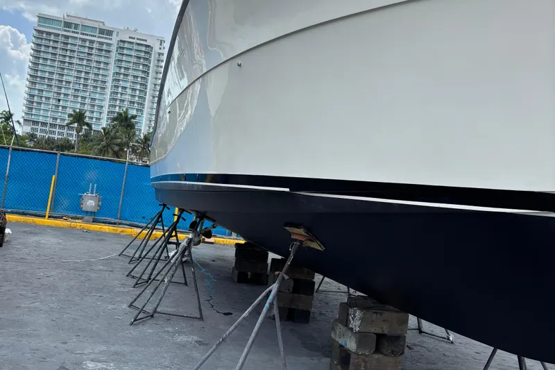  Yacht Photos Pics 1990 Viking 43 Convertible yacht on dry dock, with urban backdrop.