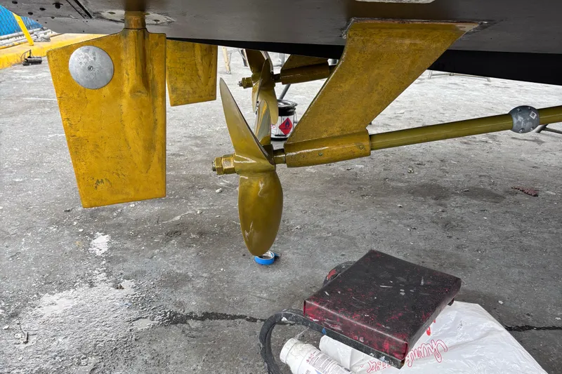  Yacht Photos Pics Propeller and rudder of a 1990 Viking 43 Convertible boat on dry dock.