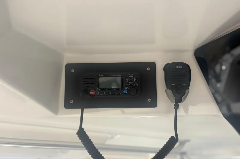 Distraction Yacht Photos Pics ICOM radio system on a 2004 Luhrs 32 Open boat dashboard.